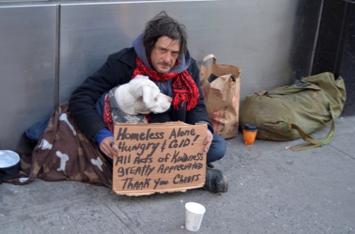 homeless-person-with-sign-dog-shutterstock_96134678